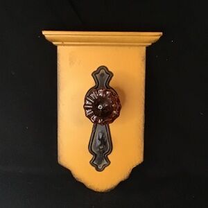Victorian ornate metal door knob, door handle, coat hanger, with a small shelf.
